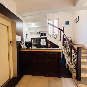 a stairway with a counter and a stair case at Pepper Route, Fort Kochi in Fort Kochi