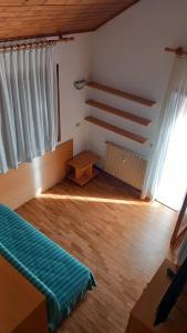 A bed or beds in a room at Residence Tarvisio Camporosso