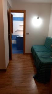A bed or beds in a room at Residence Tarvisio Camporosso