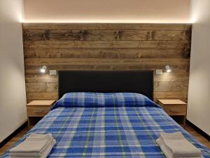 Rúm í herbergi á Albergo Baffo