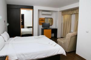 Säng eller sängar i ett rum på Hotel Zlatograd