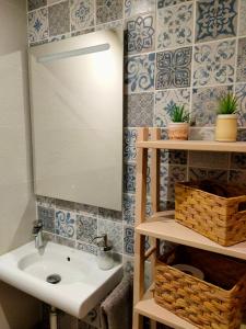 a bathroom with a sink and a mirror at Cal Marsal in Aitona +31 photos