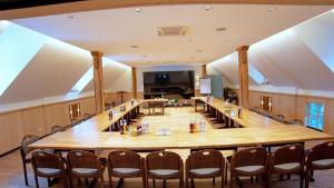 a large conference room with a large table and chairs at Hotel Brauhaus Wiesenmühle in Fulda