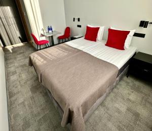 Postel nebo postele na pokoji v ubytování Tõrva Veemõnula Spaahotell