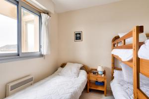 Posteľ alebo postele v izbe v ubytovaní Face mer à 85m plage - appart 2 adultes 2 enfants