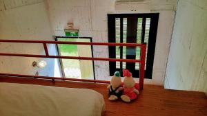Postel nebo postele na pokoji v ubytování Kelly Field Homestay