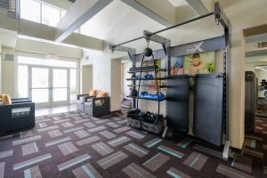 a fitness room with a gym with shoes on display at San Bruno 1br w gym pool wd nr stores SFO-1145 in San Bruno