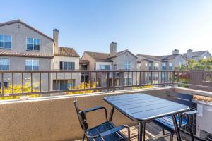 a patio with a table and chairs on a balcony at San Jose - The Alameda 2br w gym pool SFO-1153 in San Jose