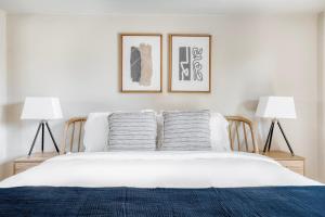 a bedroom with a white bed with two lamps at Palo Alto 1br w gym pool bbq nr tech HQs SFO-1256 in Palo Alto +17 photos