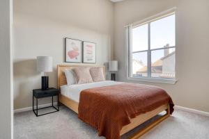 a bedroom with a bed and a window at San Jose - The Alameda 2br w gym pool SFO-1153 in San Jose +23 photos