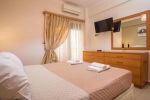 A bed or beds in a room at Anita Luxury Apartment