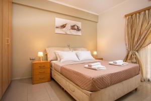 A bed or beds in a room at Anita Luxury Apartment