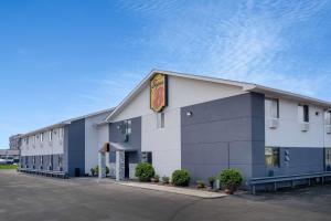 a hotel with a sign on the side of a building at Super 8 by Wyndham Merrillville in Merrillville