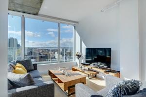 Μια τηλεόραση ή/και κέντρο ψυχαγωγίας στο Les Immeubles Charlevoix - Le 760-705