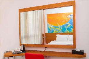 Postel nebo postele na pokoji v ubytování Best Western Arcachon Le Port
