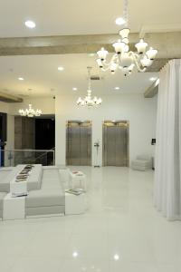 Кровать или кровати в номере Kyriad Prestige Perpignan Centre Gare