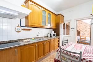 Kuchyň nebo kuchyňský kout v ubytování Travessa Albufeira Apartments by Umbral