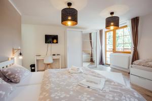 Postel nebo postele na pokoji v ubytování Hotel SEVERKA