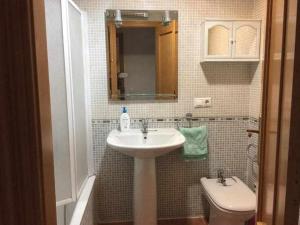 a bathroom with a sink and a toilet at Apartamento Casa Valero in Rubielos de Mora +15 photos