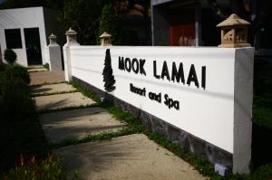 a sign that reads look llama next to a house at Mook Lamai Resort and Spa in Ko Mook