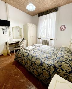 Postel nebo postele na pokoji v ubytování Hotel Terzo Crotto