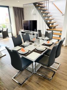a dining room with a table and chairs at Holiday Luxury Resort Sundance in Trogir
