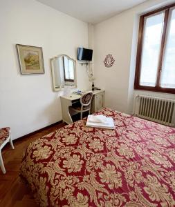 Postel nebo postele na pokoji v ubytování Hotel Terzo Crotto