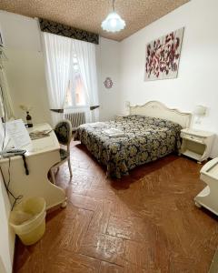 Postel nebo postele na pokoji v ubytování Hotel Terzo Crotto