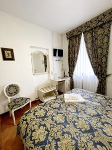 Postel nebo postele na pokoji v ubytování Hotel Terzo Crotto