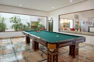 a billiard room with a pool table in it at Zodiaco in Quarteira