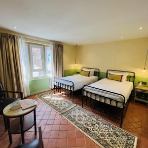 En eller flere senge i et værelse på Seto Ghar Hotel
