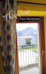 a window with a view of a view from the kitchen at Il Monte Farmhouse in Torricella Peligna