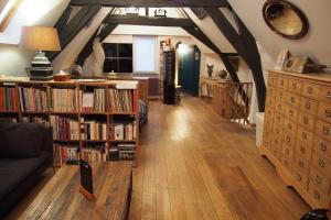 a living room with bookshelves and a couch at My House in Brussels in Brussels