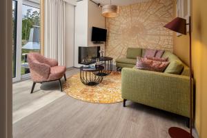 TV a/nebo společenská místnost v ubytování Terhills Resort by Center Parcs