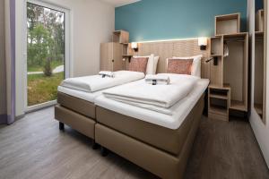 Postel nebo postele na pokoji v ubytování Terhills Resort by Center Parcs