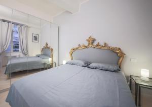 Postel nebo postele na pokoji v ubytování Apartments Florence Parione