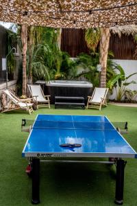 a ping pong table in the middle of a yard at Country Villa - Ella Sun in Eilat