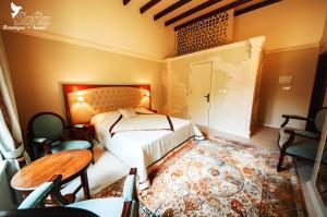 Кровать или кровати в номере SOFIA BOUTIQUE HOTEL