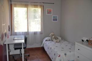 Postel nebo postele na pokoji v ubytování CAL XECARMA