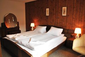 Rúm í herbergi á Rooms with Private bathrooms