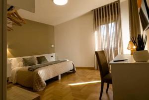 En eller flere senge i et værelse på La casa di Gio’