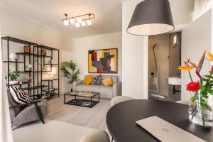 a living room with a table and a couch at Casa San Lio in Noto