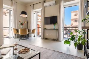 a living room with a view of a city at Casa San Lio in Noto