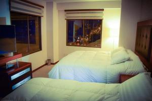 Cama o camas de una habitación en HB Apartament Sopocachi