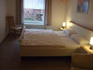 En eller flere senge i et værelse på Ferienhof-Nickelswarft