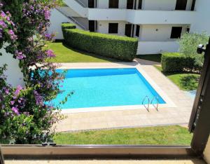 Bazén v ubytovaní VACAY Apartamento Fanny, a pie de playa, en la Costa brava, L'Escala! alebo v jeho blízkosti