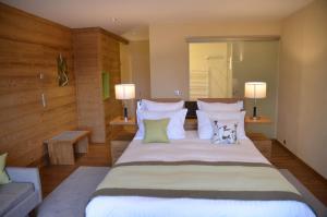 Postel nebo postele na pokoji v ubytování Hotel Le Caballin