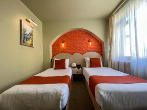 Кровать или кровати в номере By Kinyas Hotel
