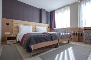 Ліжко або ліжка в номері Hotel Srbija Garden-FREE PARKING