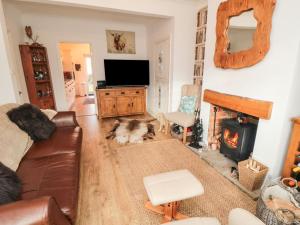 a living room with a couch and a fireplace at Seaside House in Scarborough